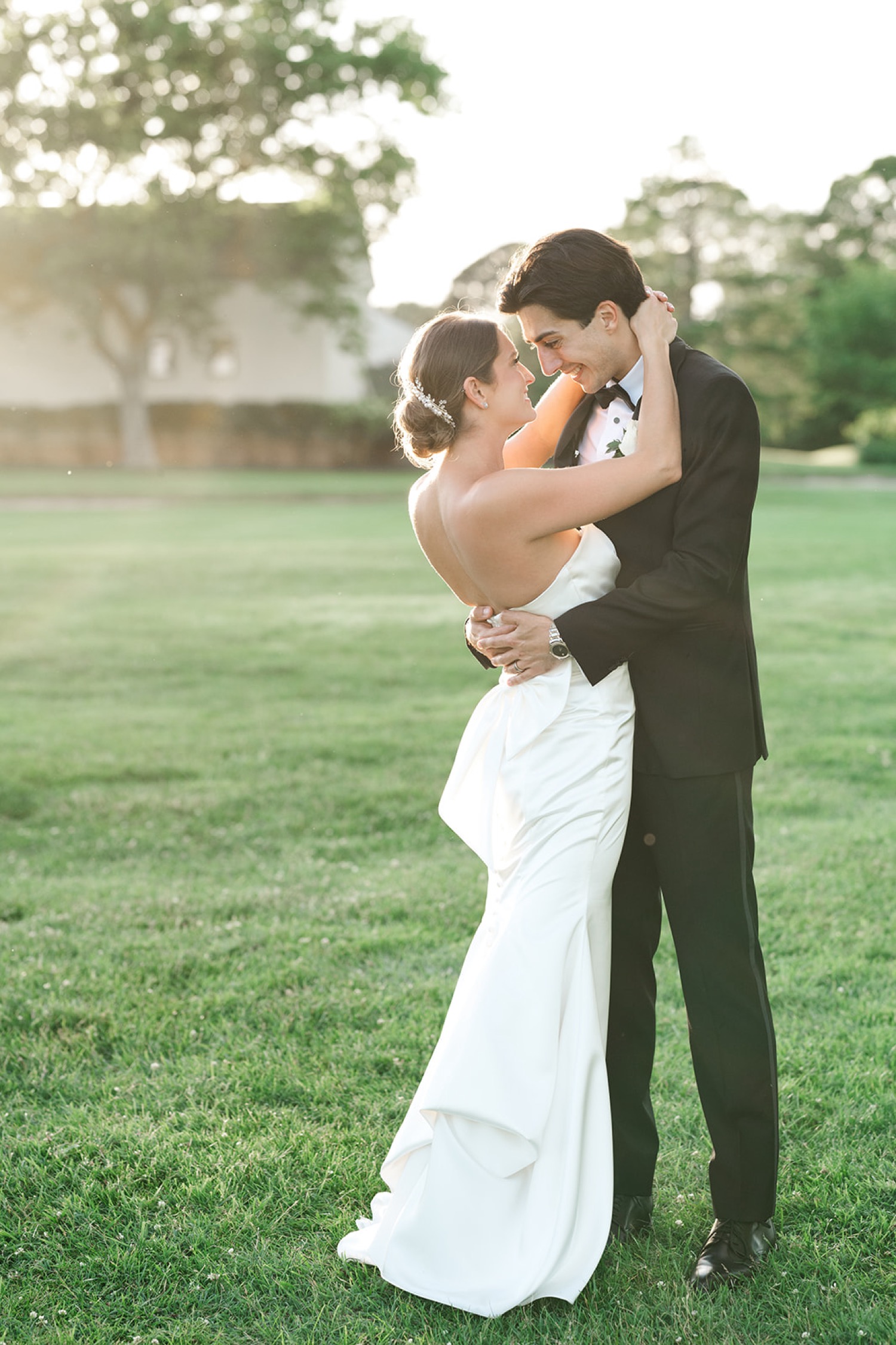 Sunset bride and groom portraits on golf course