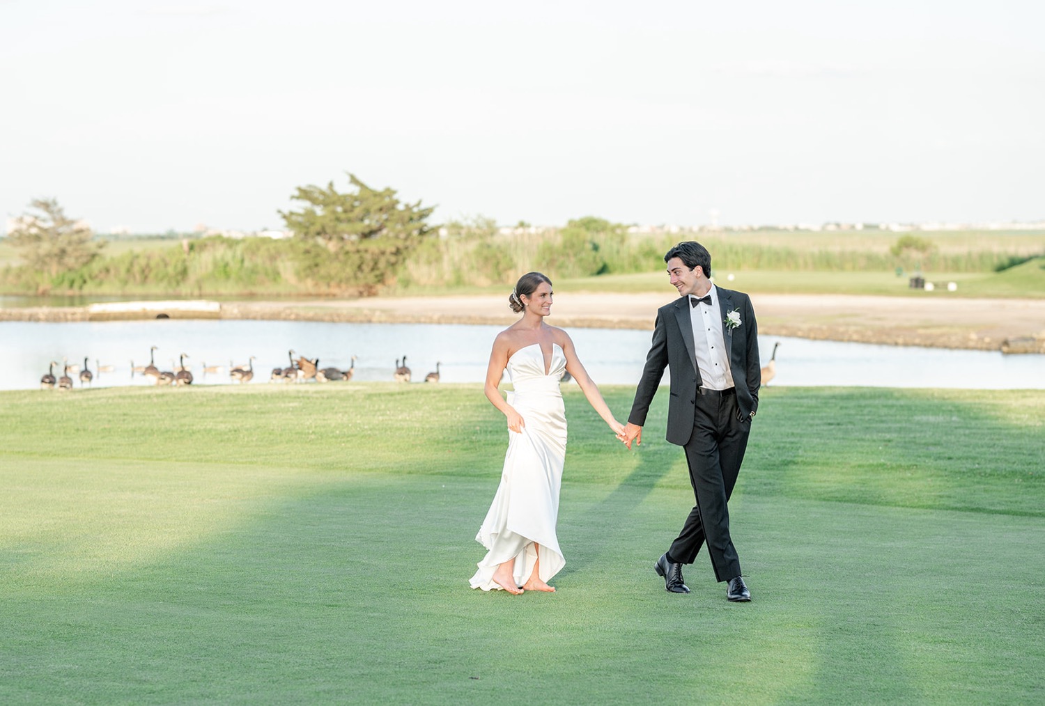 Sunset bride and groom portraits on golf course