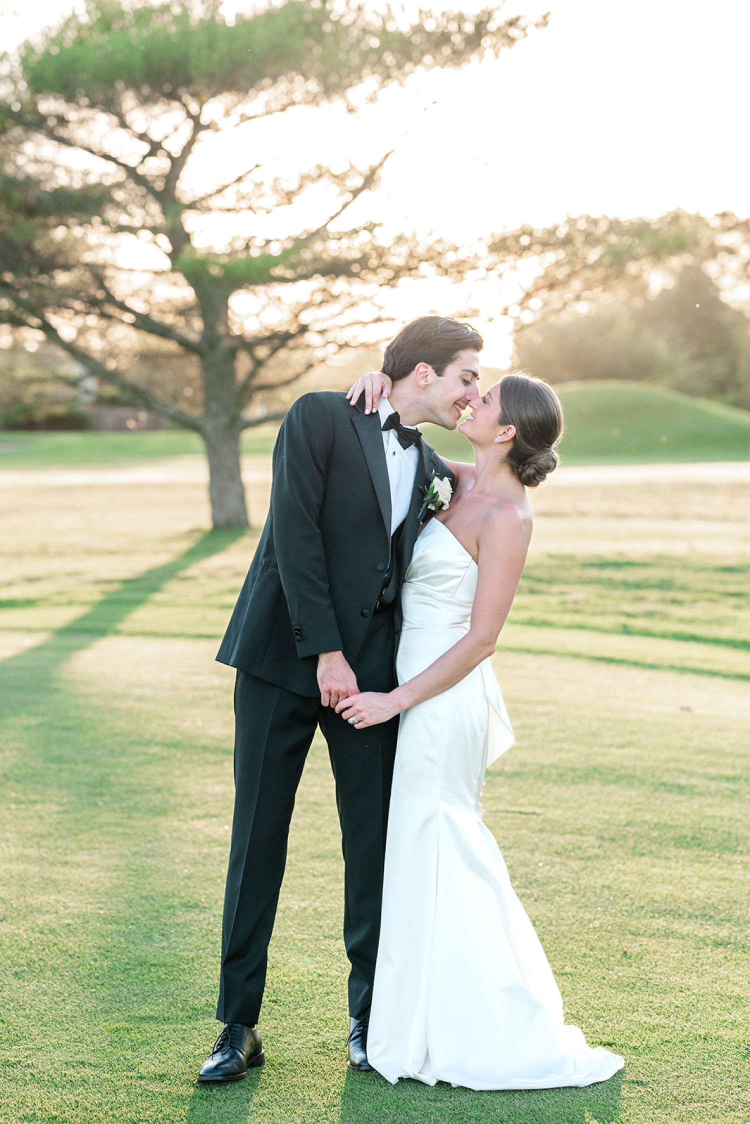 Sunset bride and groom portraits on golf course