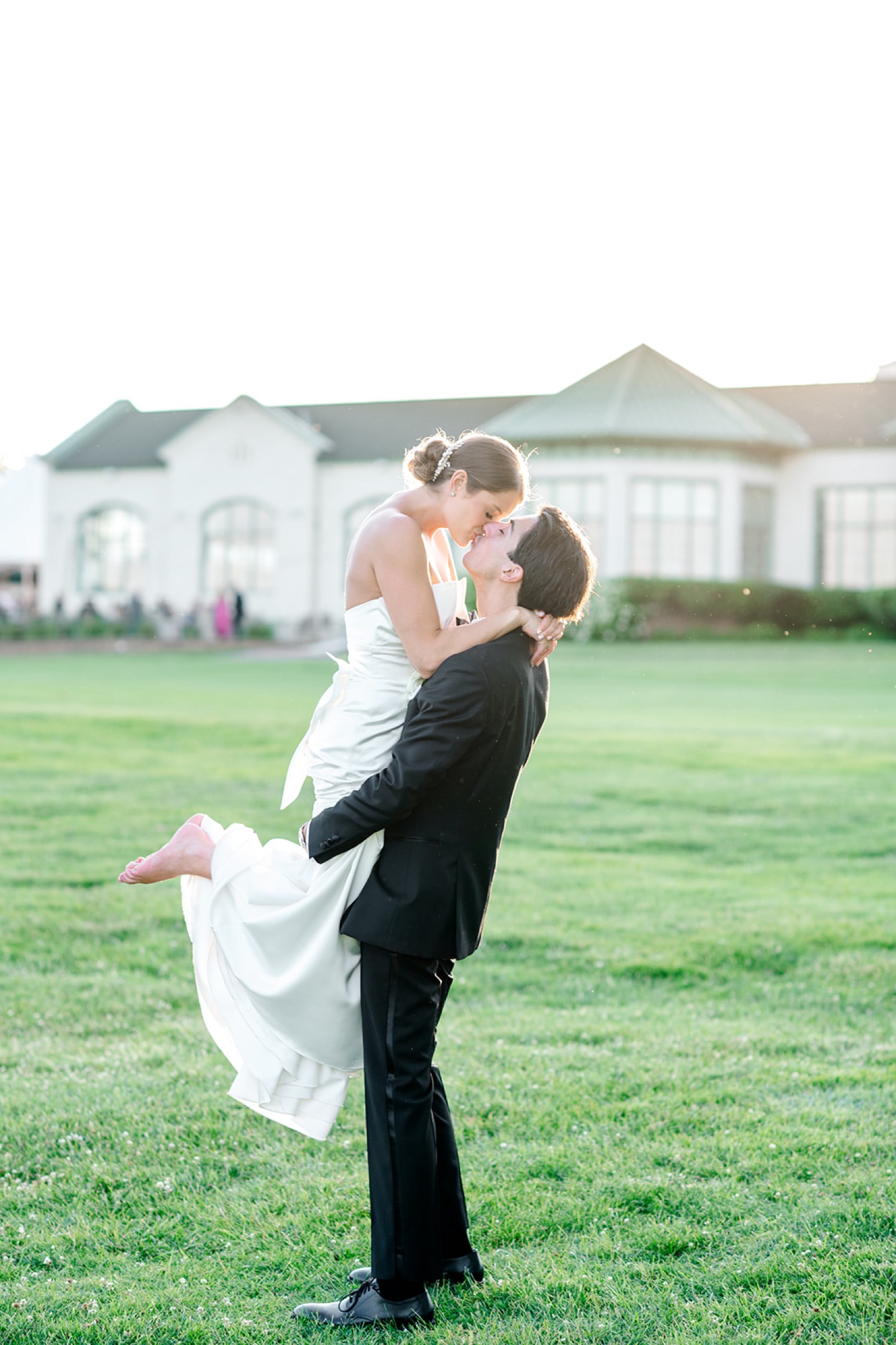 Sunset bride and groom portraits on golf course